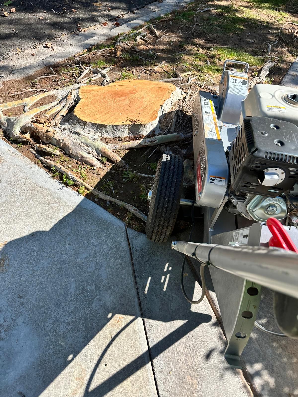 Professional stump grinding equipment in use